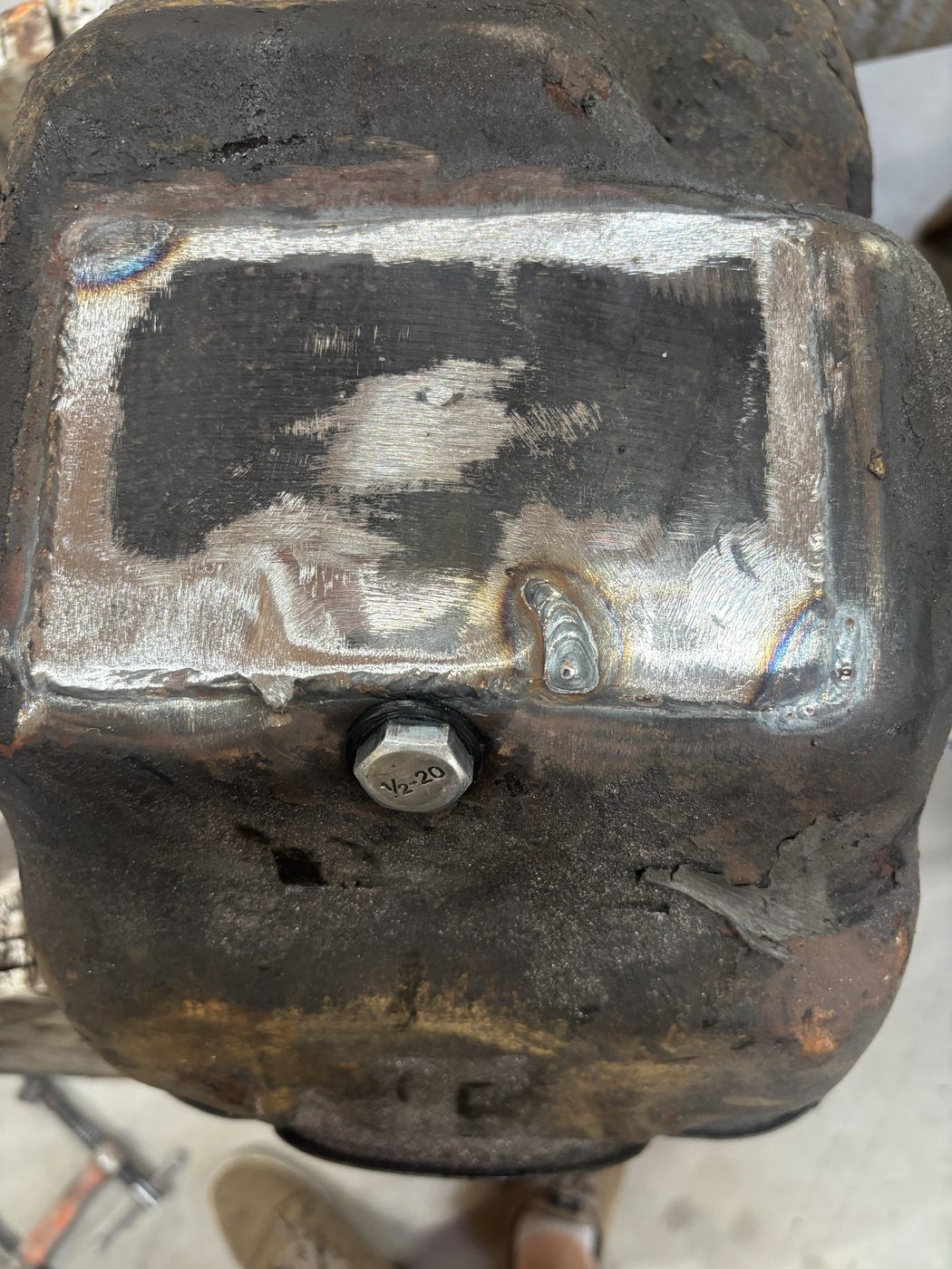 Completed oil pan repair, ground smooth and ready to reinstall