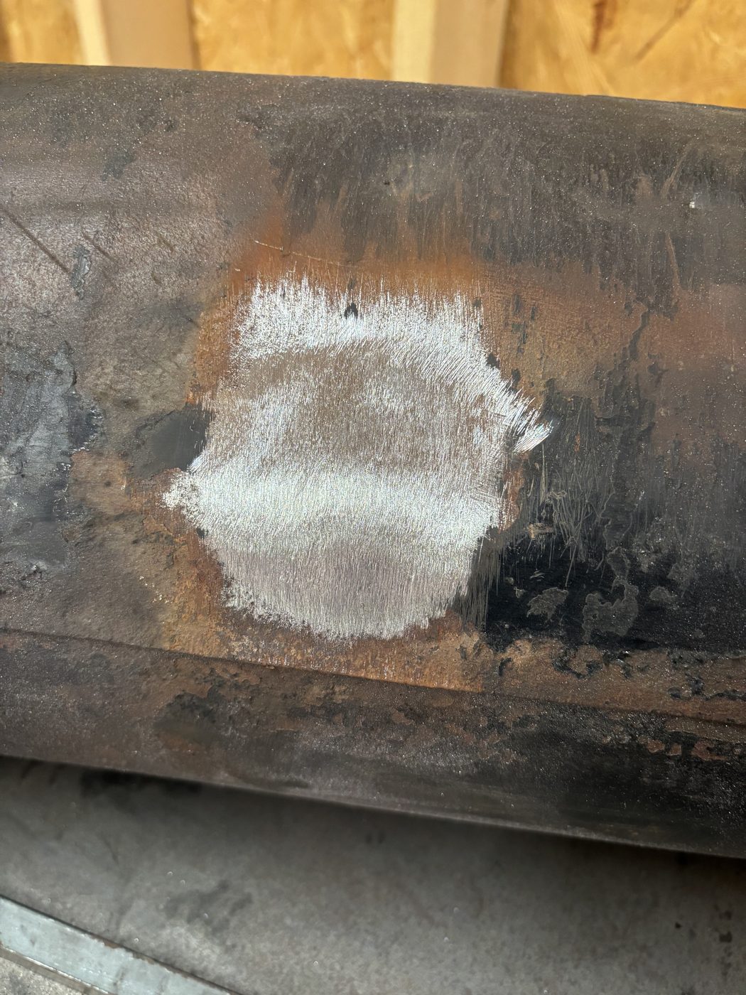 Tank surface prepped and ground smooth around new weld