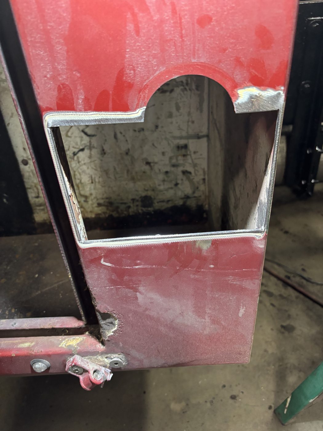 Rust-out panel cut away and replaced with welded steel patch